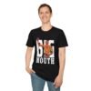 a happy guy wearing a Kevin Holland black T-shirt