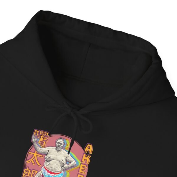 a black hoodie with Former sumo grand champion Akebono Taro