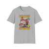 Greatest vs Baddest Tee in gray folded next to gloves